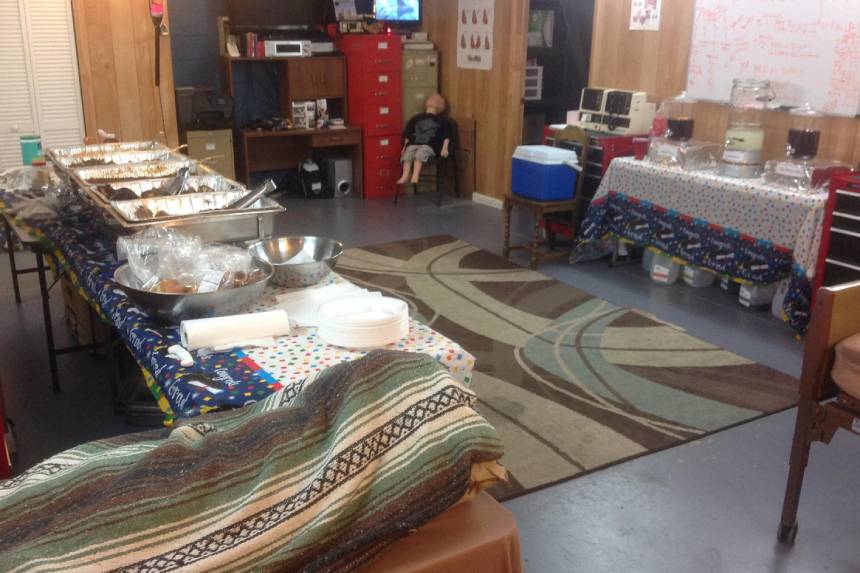 A room with many blankets and rugs on the floor