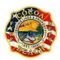 A red, white and blue circle with the words cocoa beach fire department in it.
